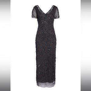 Slate gray beaded Pisarro Nights formal gown.